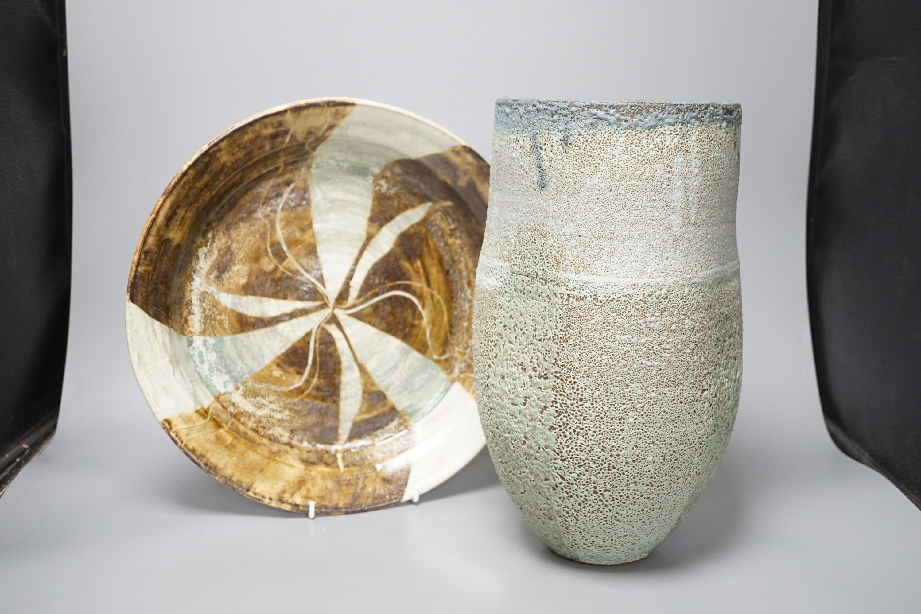 A large raku studio pottery vase, height 33cm, and a stoneware dish